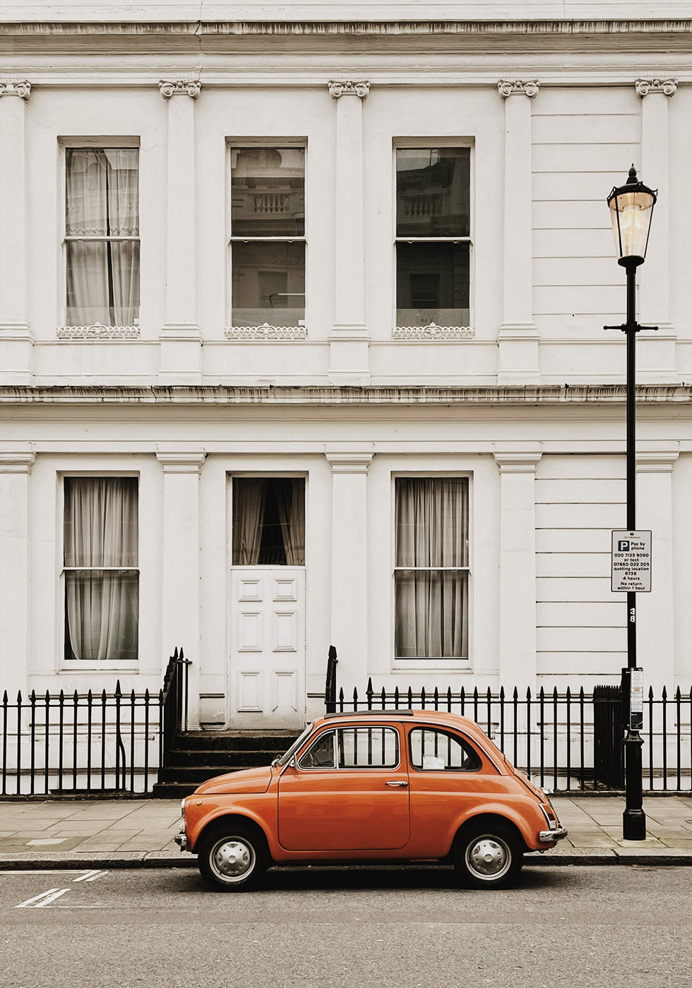 Charming Urban Scene with Orange Car Poster - Posterbox.dk
