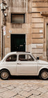 A Small White Car Poster - Posterbox.dk