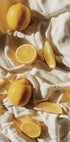 Vibrant Lemons on Textured Fabric Poster - Posterbox.dk