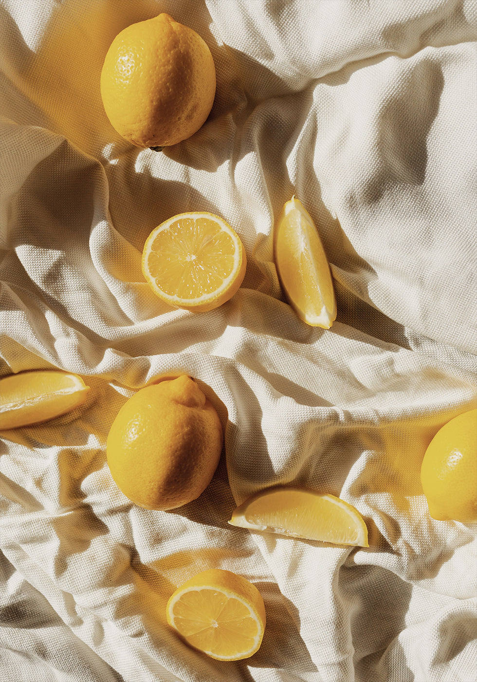 Vibrant Lemons on Textured Fabric Poster - Posterbox.dk