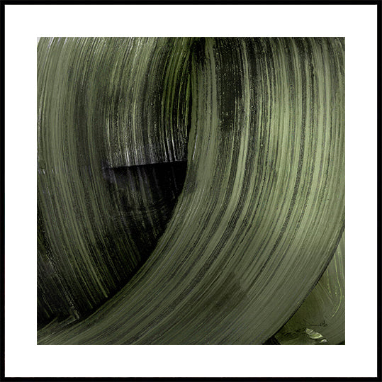 The image is a close-up of a textured, green-coloured surface, possibly a leaf or a fabric. The surface has a repeating pattern of vertical lines and curves, creating a sense of movement and depth. The image does not contain any discernible objects or actions, and there are no specific actions or movements captured. The image is a still life composition, focusing on the texture and pattern of the green surface.