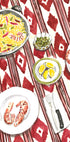 a table set with a variety of food items, including shrimp, vegetables, and a bowl of rice.