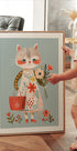 Cat in Floral Dress Holding Flowers Poster - Posterbox.dk