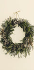a christmas wreath hanging on a wall