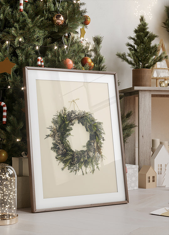 a picture of a Christmas wreath on a table next to a Christmas tree