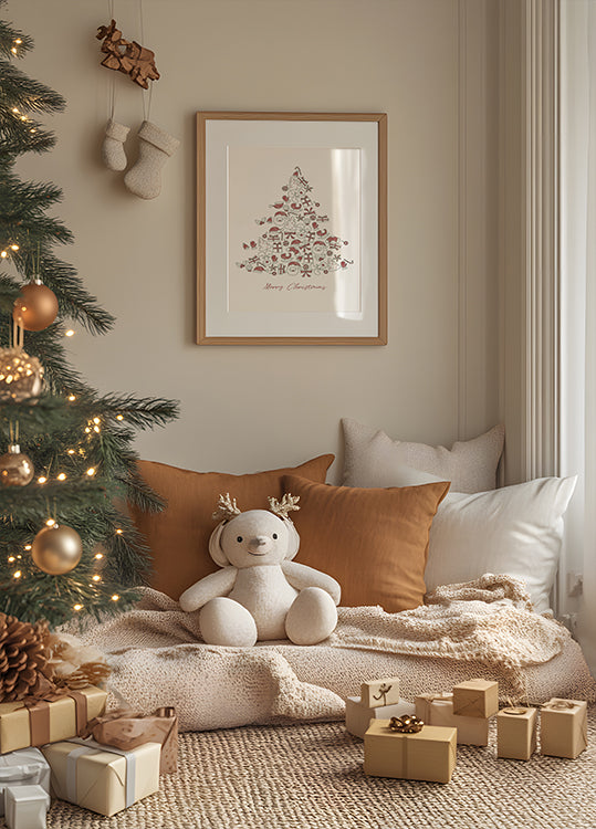 a teddy bear sitting on a pillow in front of a Christmas tree
