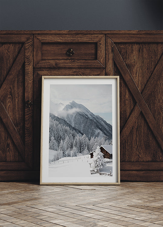 Snow-Covered Cabin in the Alps Poster - Posterbox.dk
