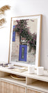 Vibrant Doorway with Bougainvillea Poster - Posterbox.dk